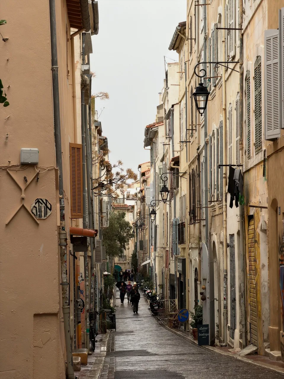 A narrow lane of tall ochre houses.