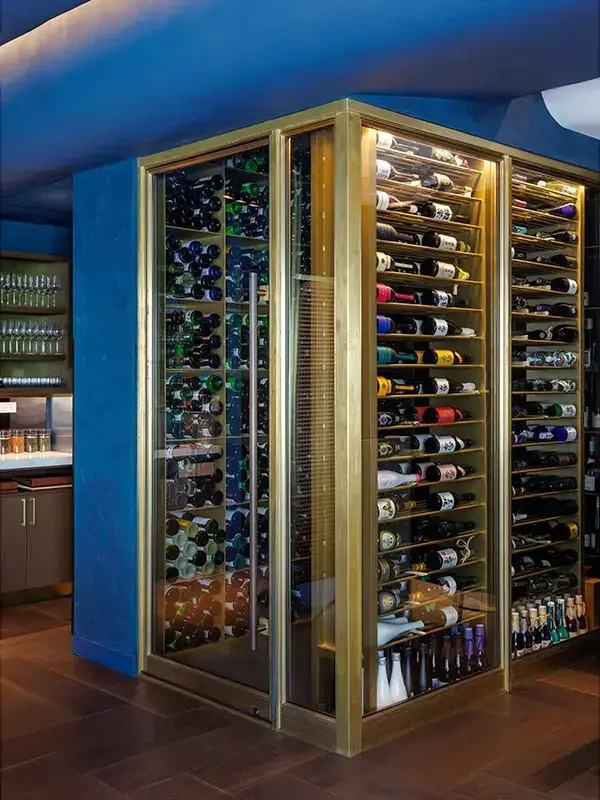 Brass-framed wine cellar